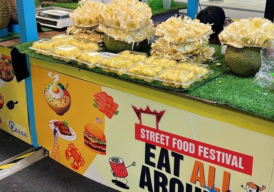 Durian pieces in boxes at a street food festival stall