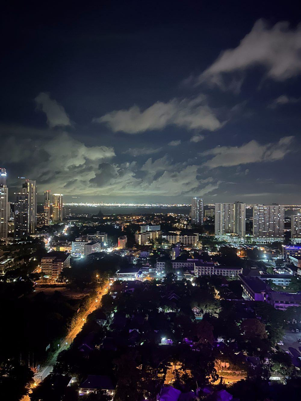 Pattaya skyline at night with the bay in the distance